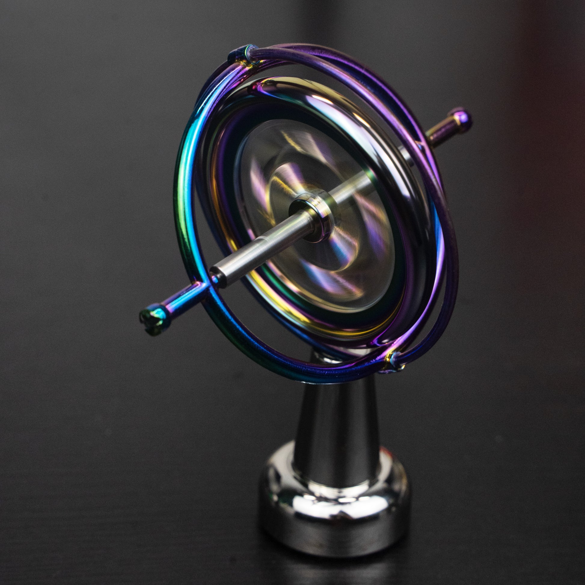 Orbitrix rainbow gyroscope close-up, angled view