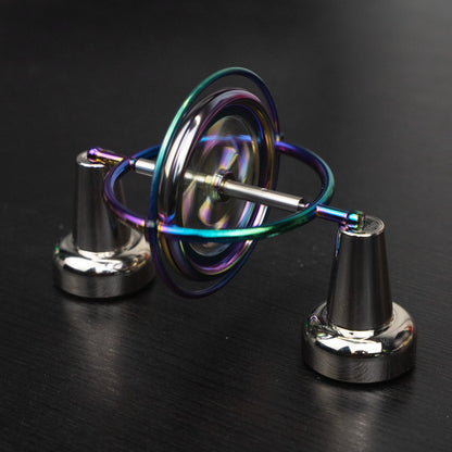 Orbitrix rainbow gyroscope balanced on a two-point stand